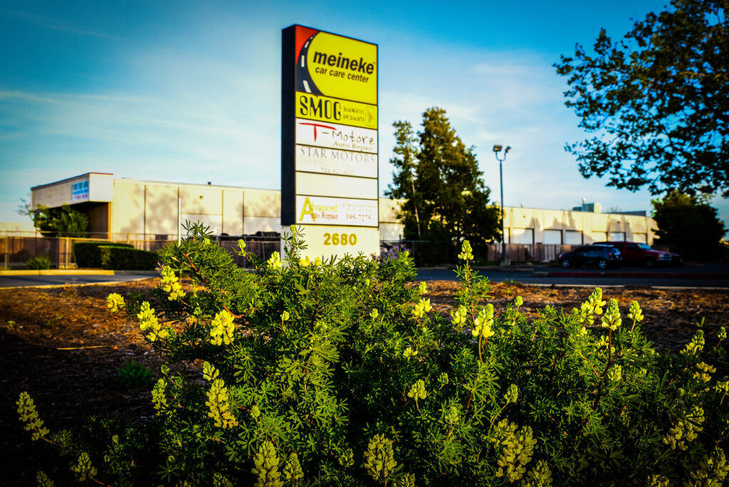 advertisement showing meineke car care center, and more