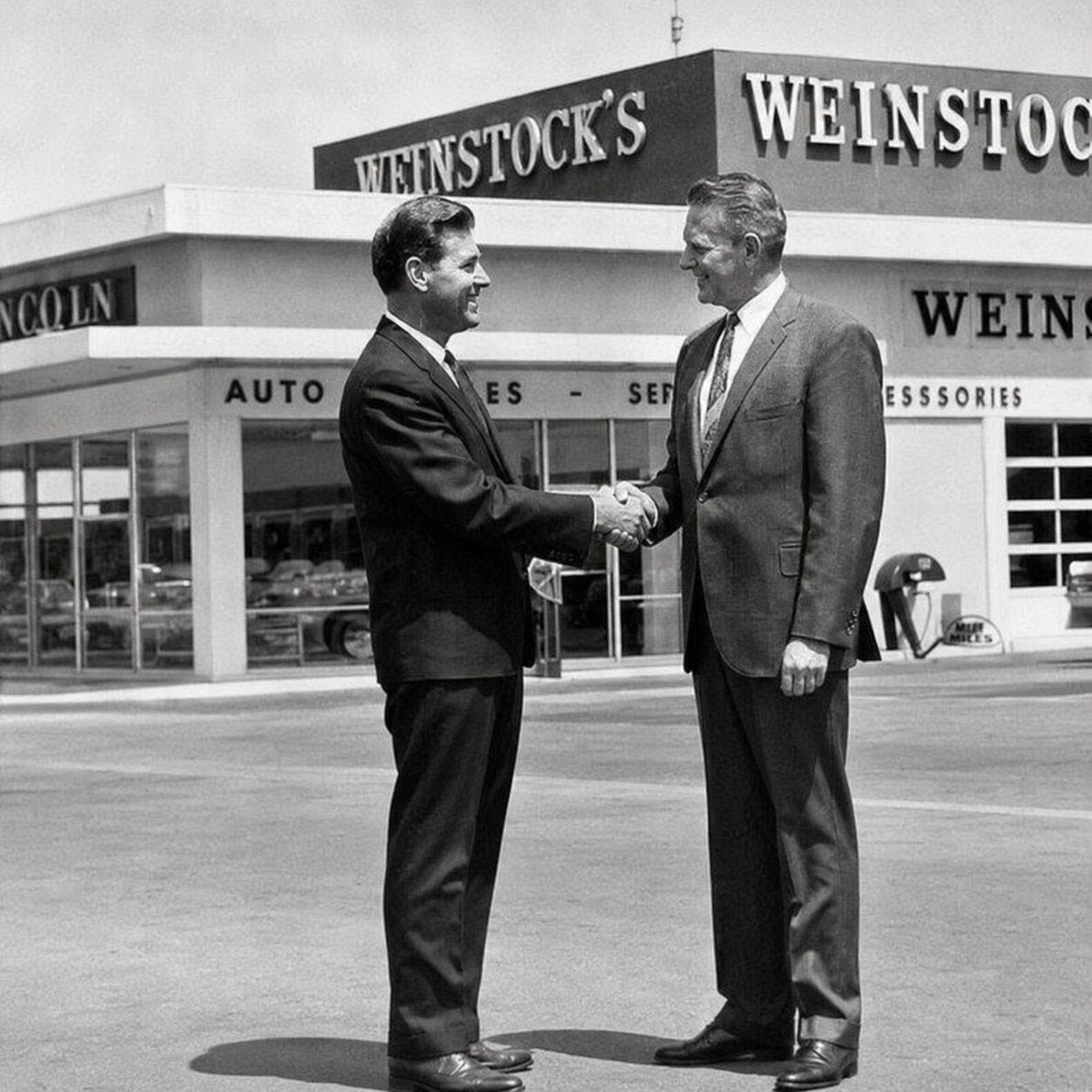 an old picture of 2 guys shaking hands